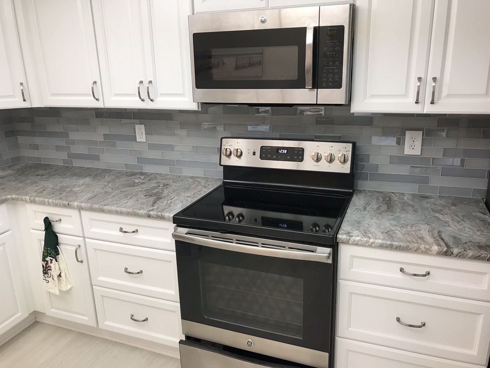 White Kitchen Remodel by Mann Tile, Inc. — Project 2 project photo