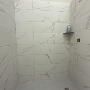 Essential Shower Kit in Marble Look finish by Mann Tile in Sarasota and Englewood.