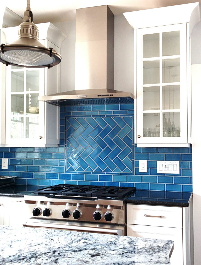 Tile Backsplashes Aren’t Out—Not Even Close 2 herringbone backsplash